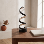 Elica dimmable spiral LED table lamp — on a study desk