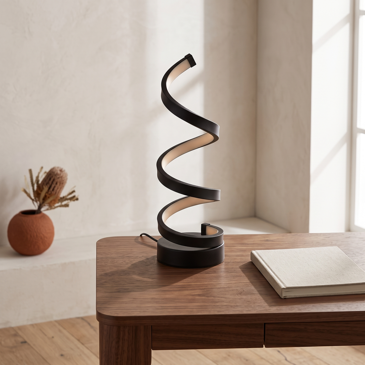 Elica dimmable spiral LED table lamp — on a study desk