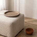 Fattoria rustic wooden serving tray — on a living room ottoman